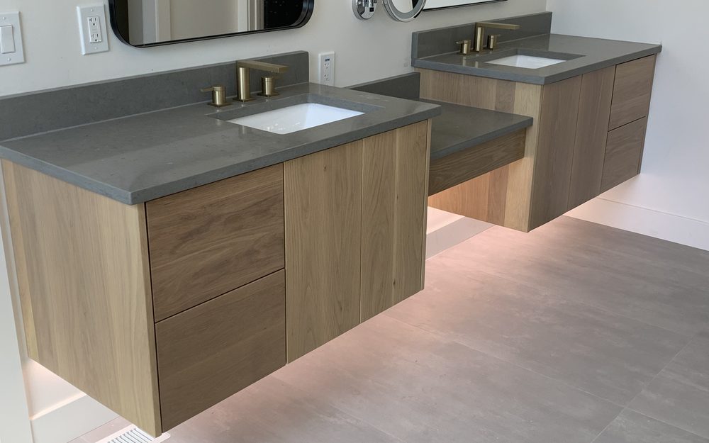 Wood double-sink bathroom vanity with stone counter