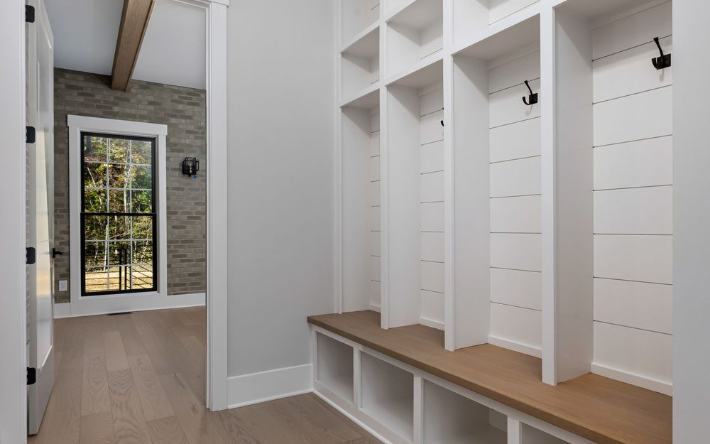 White entryway cubbies and bench storage