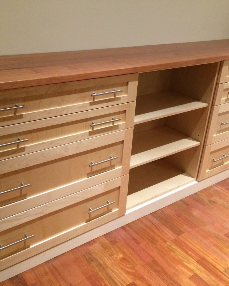 Long wood storage cabinet with drawers and display area