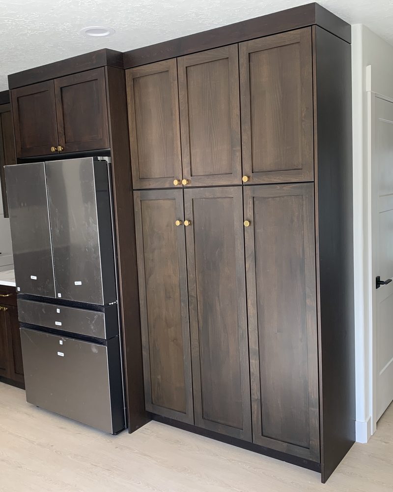 Tall wood cabinets fitted into a home interior